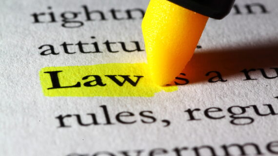 a highlighter pen with law defined in a dictionary